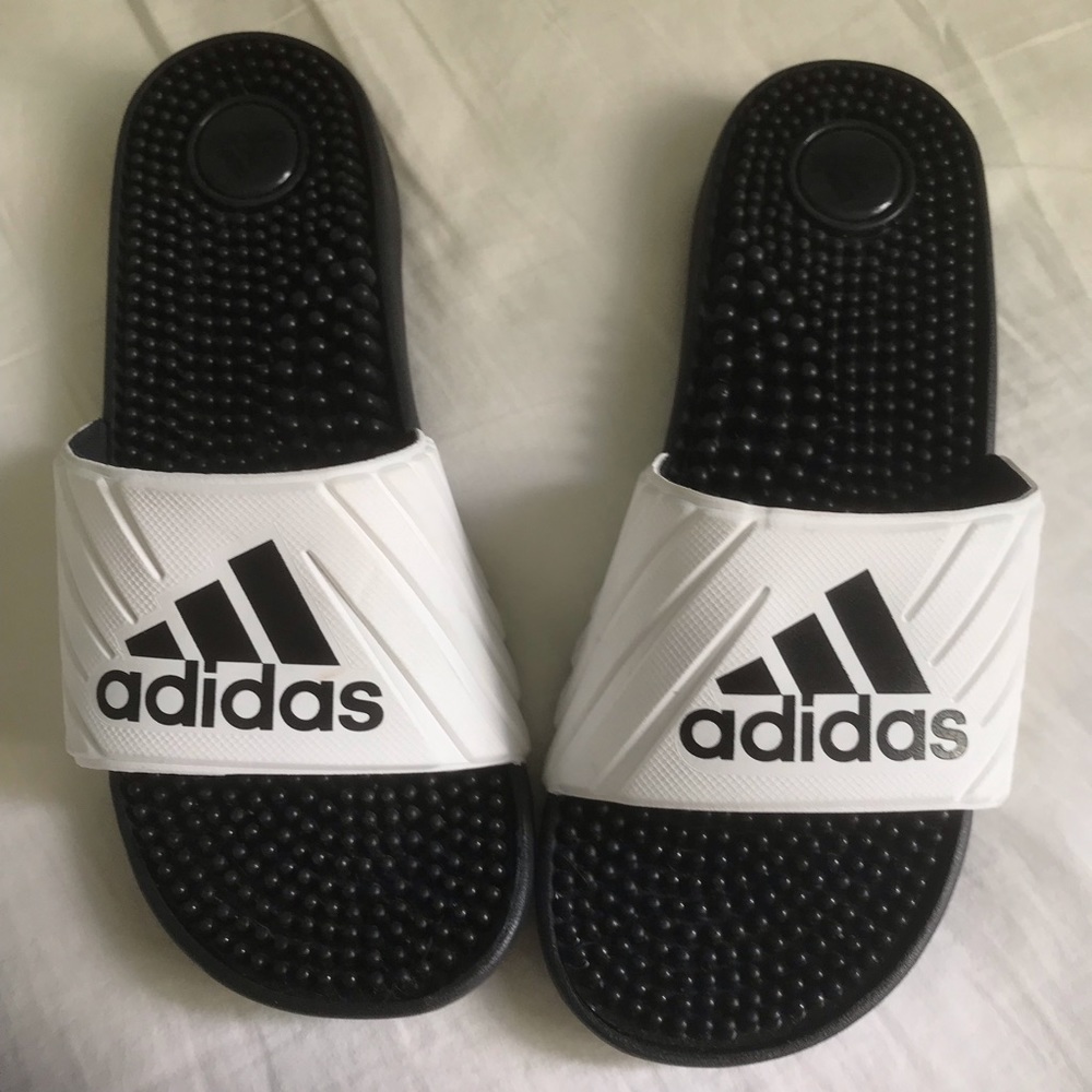 White and black Adidas slides